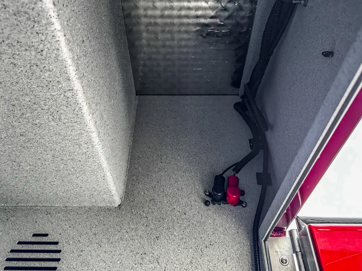 Rear body compartment open view with interior storage bay visible.